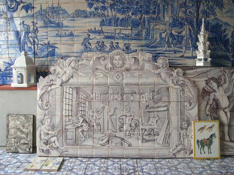 some tiles and murals exhibited in the showroom of the Paris-based Almaviva tile studio